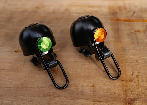 Zvonek na kolo Spurcycle Original Limited Black/Orange a Black/Green